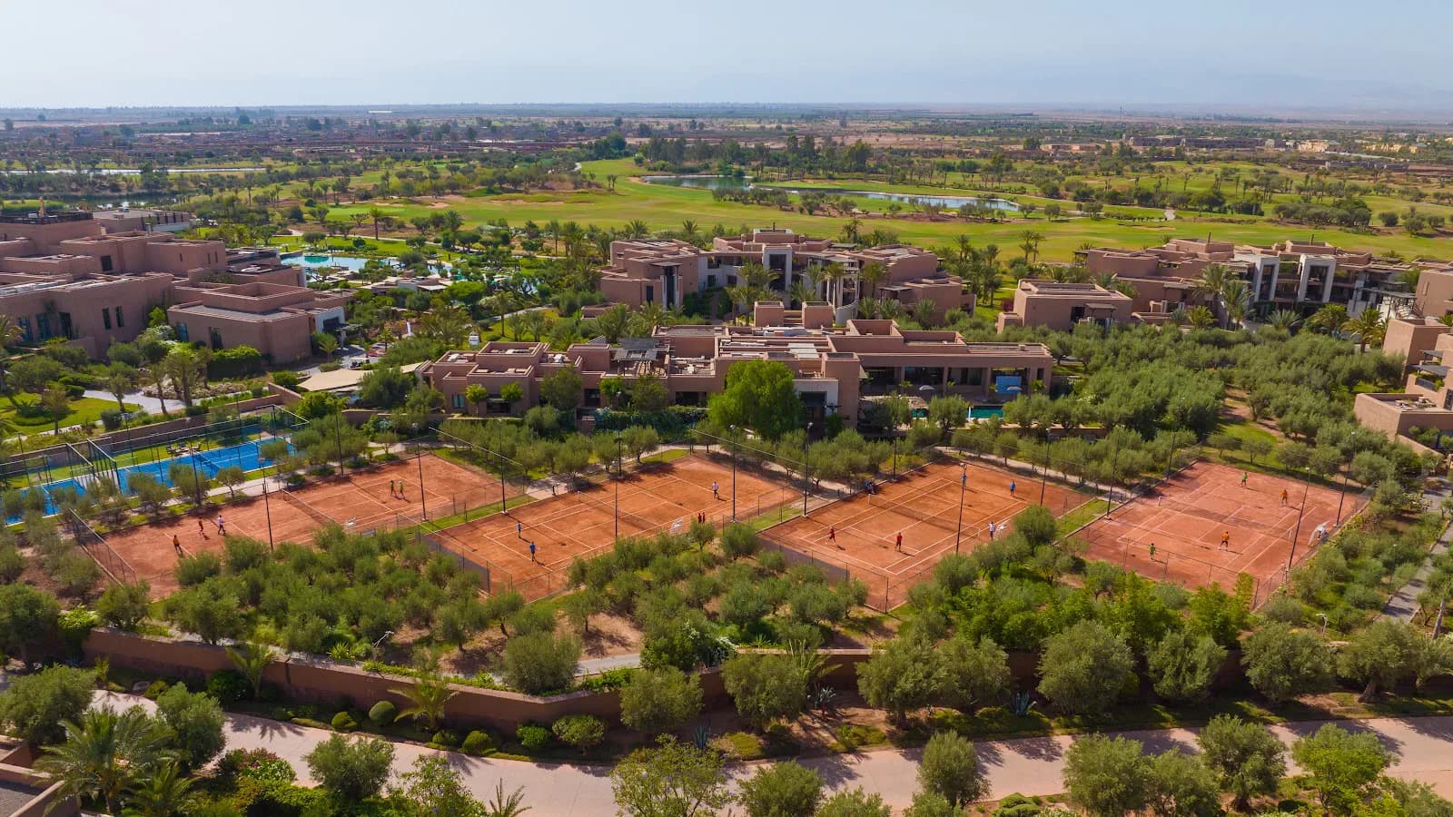 Clay-Court Tennis Session Amid Moroccan Olive Groves