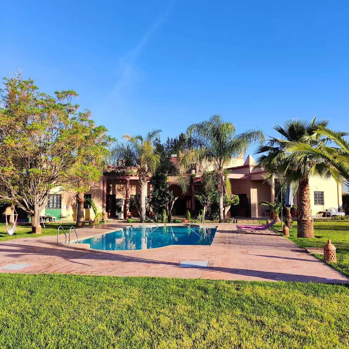 Poolside Relaxation in a Moroccan Garden Villa